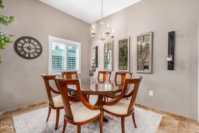 dining area featuring a notable chandelier