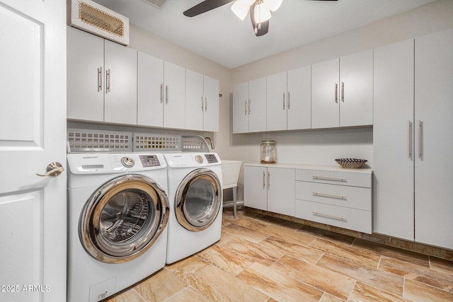 laundry room with cabinets, separate washer and dryer, and ceiling fan