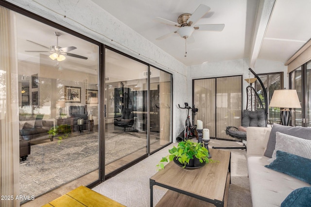 living room featuring vaulted ceiling with beams and ceiling fan