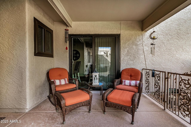 view of patio featuring a balcony