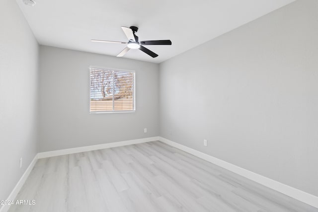 empty room featuring ceiling fan and light hardwood / wood-style floors