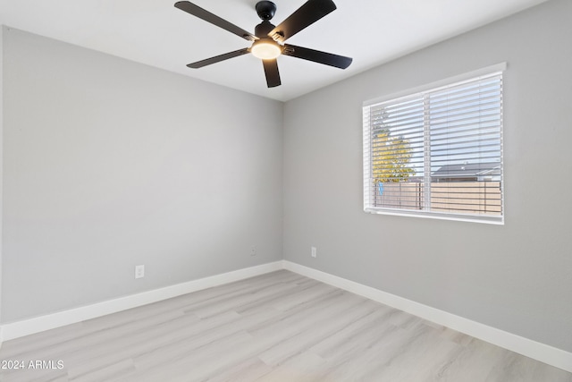 empty room with light hardwood / wood-style floors and ceiling fan