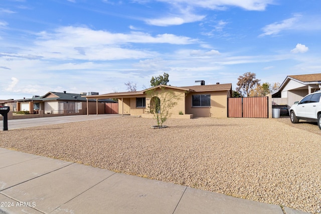 ranch-style house with a carport