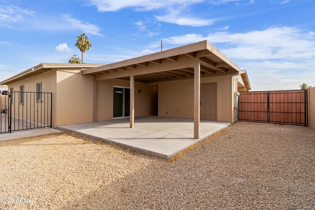 back of property featuring a patio area