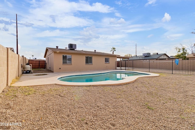 view of swimming pool featuring central AC unit and a patio area