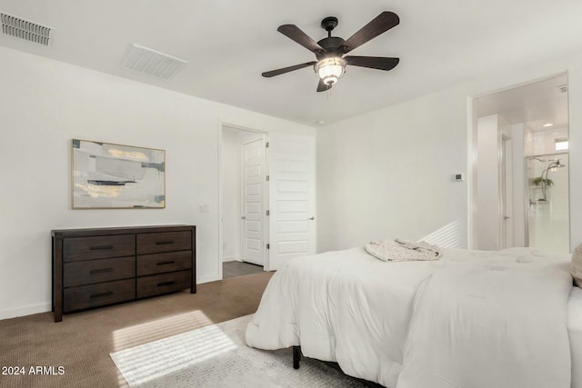 bedroom with carpet flooring, connected bathroom, and ceiling fan