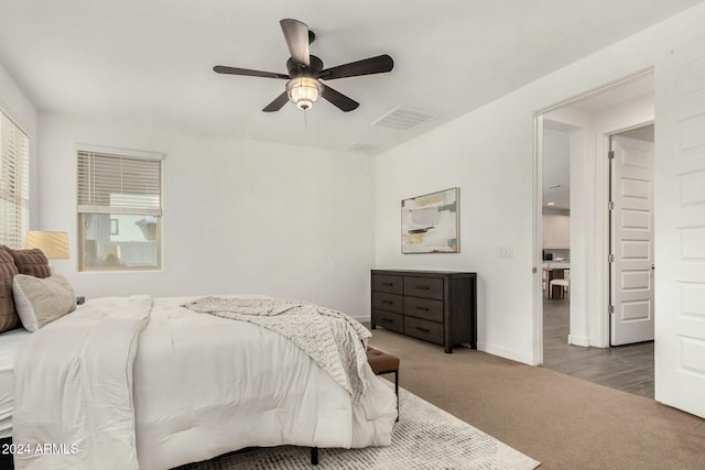 carpeted bedroom with ceiling fan