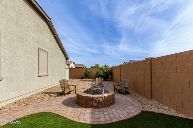 view of patio / terrace featuring a fire pit