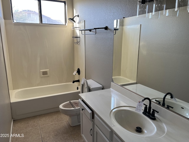 full bathroom featuring a textured wall, toilet, vanity,  shower combination, and tile patterned floors