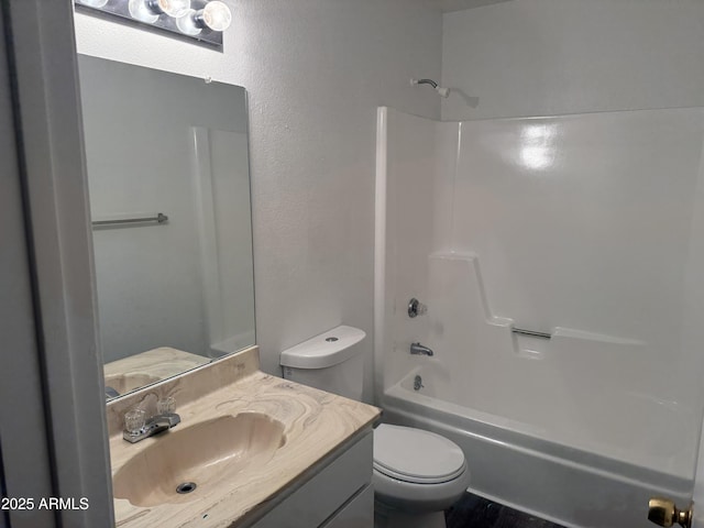 full bathroom with shower / washtub combination, vanity, and toilet