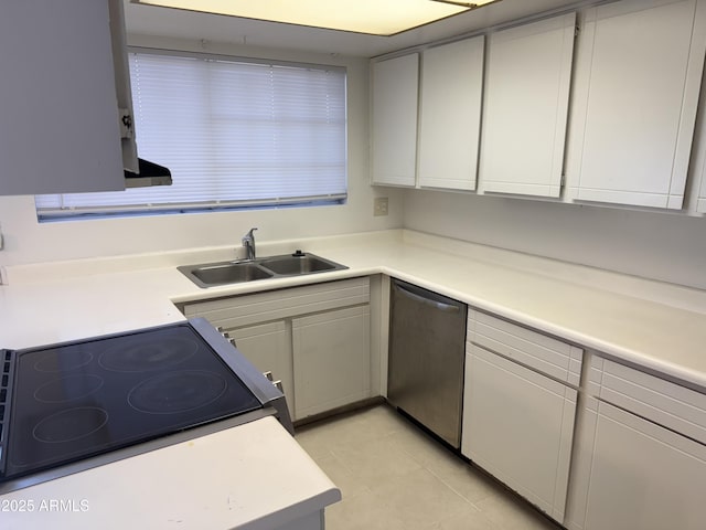 kitchen with range, dishwasher, sink, and light tile patterned floors