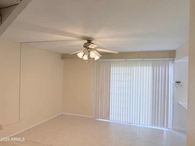 unfurnished room with ceiling fan