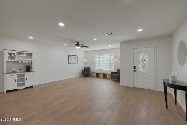 entrance foyer with ceiling fan and light wood-type flooring