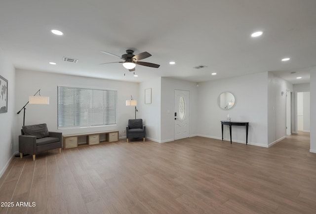 interior space with light hardwood / wood-style flooring and ceiling fan