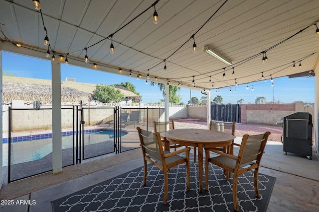 view of patio featuring a fenced in pool