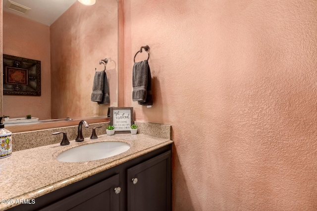 634 W Aviary Way, Gilbert, AZ 85233 - bathroom featuring a textured wall and vanity