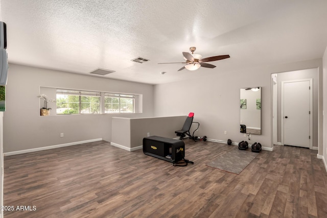 634 W Aviary Way, Gilbert, AZ 85233 - workout area featuring ceiling fan, wood finished floors, baseboards, and a textured ceiling