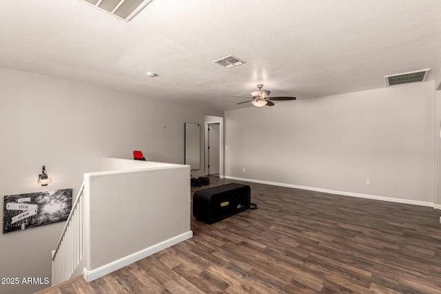 634 W Aviary Way, Gilbert, AZ 85233 - spare room featuring ceiling fan, baseboards, and dark wood finished floors