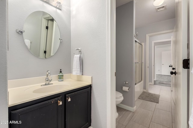 634 W Aviary Way, Gilbert, AZ 85233 - bathroom with toilet, vanity, and shower / bath combination with glass door
