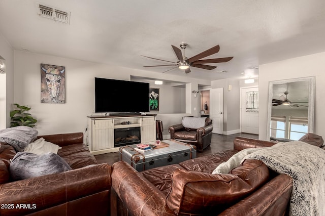 634 W Aviary Way, Gilbert, AZ 85233 - living room featuring a ceiling fan, baseboards, and a glass covered fireplace