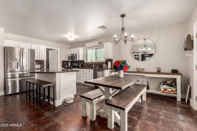 634 W Aviary Way, Gilbert, AZ 85233 - dining room with a chandelier, finished concrete floors, and baseboards