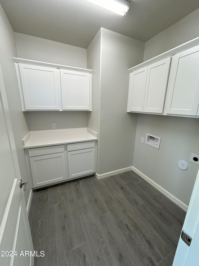 clothes washing area with hookup for an electric dryer, dark hardwood / wood-style floors, cabinets, and hookup for a washing machine