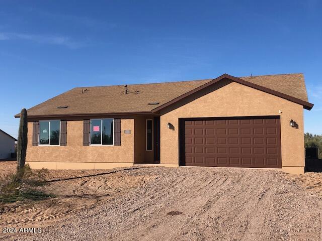 ranch-style house featuring a garage