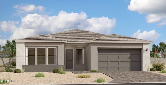 11410 E Utah Ave, Mesa, AZ 85212 - view of front facade with decorative driveway, a garage, and stucco siding