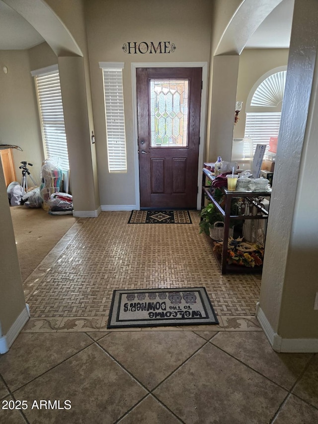 entryway with tile patterned floors