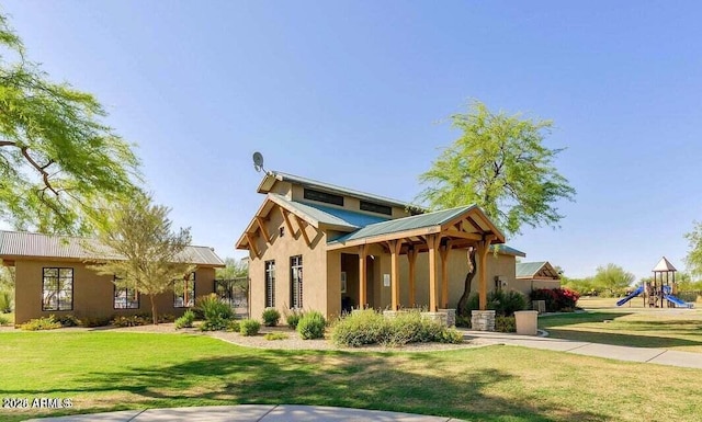 exterior space featuring a playground and a front yard