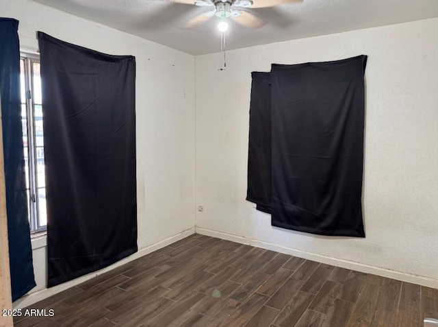 3112 W Taylor St, Phoenix, AZ 85009 - empty room featuring dark wood-type flooring, baseboards, and ceiling fan
