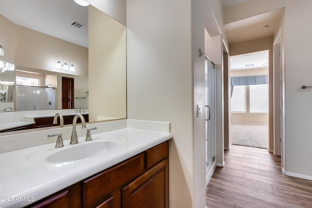 bathroom with vanity and an enclosed shower