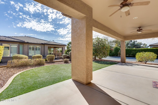 view of patio featuring ceiling fan