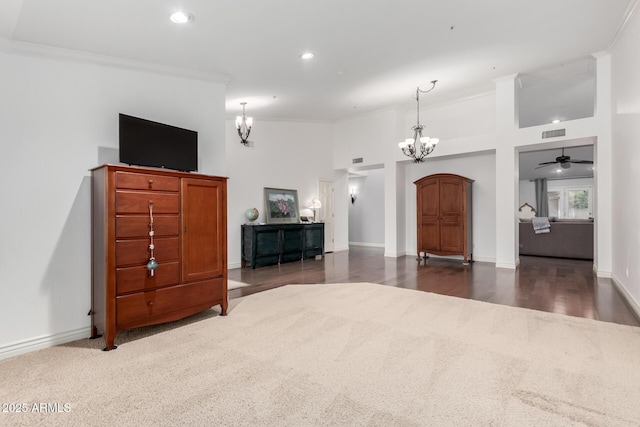 living area featuring visible vents, baseboards, ornamental molding, recessed lighting, and an inviting chandelier