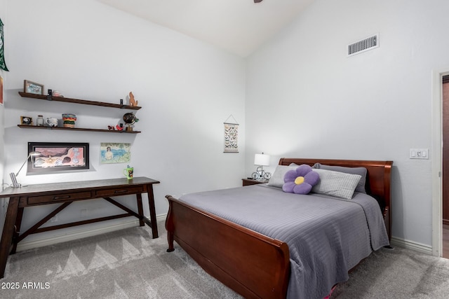 bedroom featuring visible vents, baseboards, lofted ceiling, and carpet floors