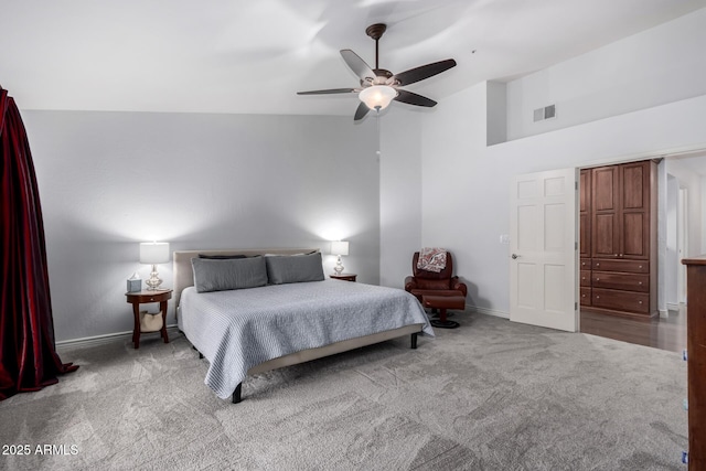 carpeted bedroom with visible vents, ceiling fan, high vaulted ceiling, and baseboards