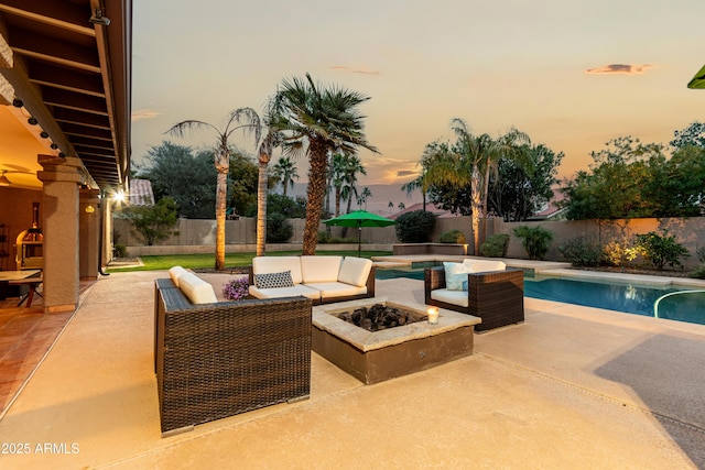 exterior space with an outdoor living space with a fire pit, a fenced backyard, and a fenced in pool