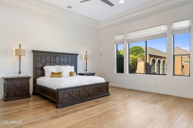 18127 N 98th Way, Scottsdale, AZ 85255 - bedroom with light wood finished floors, baseboards, recessed lighting, a raised ceiling, and ceiling fan
