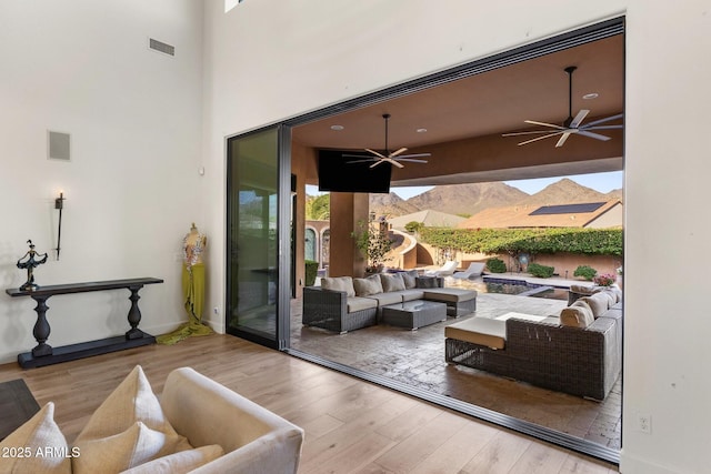 18127 N 98th Way, Scottsdale, AZ 85255 - living room with wood finished floors and a ceiling fan