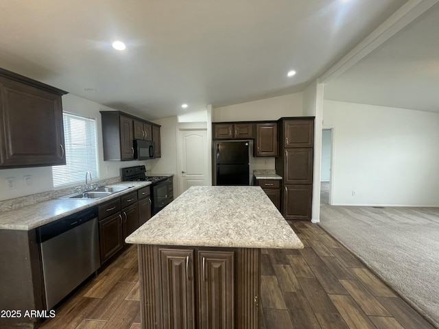 kitchen with lofted ceiling, black appliances, a sink, and dark brown cabinetry