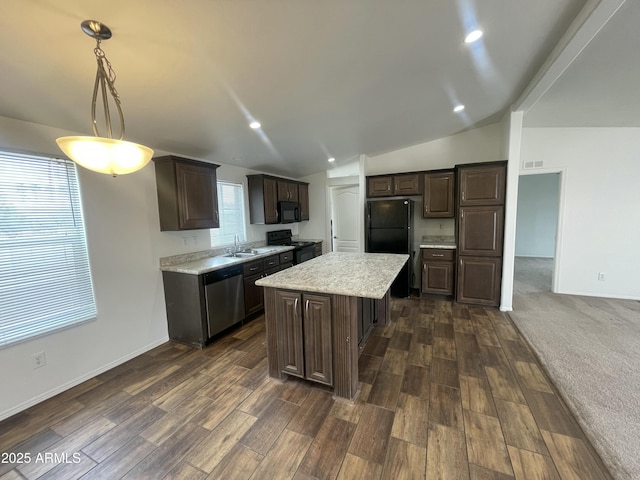 kitchen with dark brown cabinets, a sink, black appliances, vaulted ceiling, and dark wood-style floors