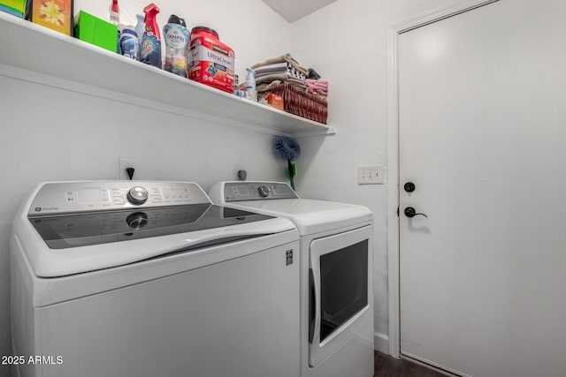 laundry area with separate washer and dryer and laundry area