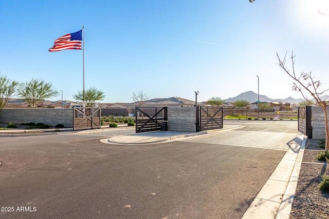 exterior space with fence and a mountain view