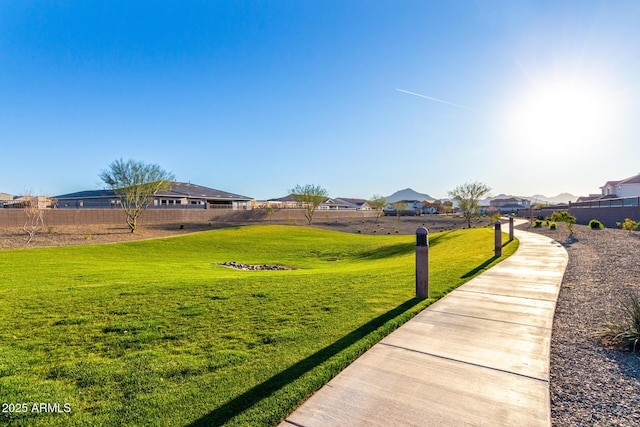 view of yard featuring a residential view and fence