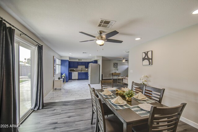 8523 W Whitton Ave, Phoenix, AZ 85037 - dining room featuring a ceiling fan, baseboards, a textured ceiling, and recessed lighting