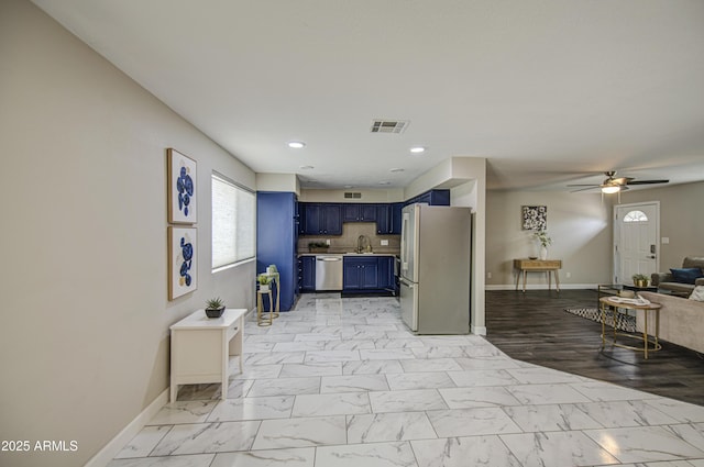 8523 W Whitton Ave, Phoenix, AZ 85037 - kitchen with blue cabinets, stainless steel appliances, open floor plan, baseboards, and a ceiling fan