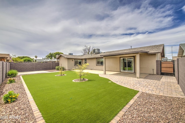 8523 W Whitton Ave, Phoenix, AZ 85037 - back of house with stucco siding, a gate, and a patio area