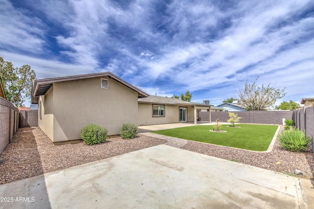 8523 W Whitton Ave, Phoenix, AZ 85037 - back of house featuring stucco siding and a patio