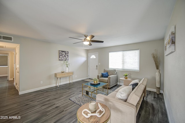 8523 W Whitton Ave, Phoenix, AZ 85037 - living room featuring dark wood-style floors, a ceiling fan, and baseboards