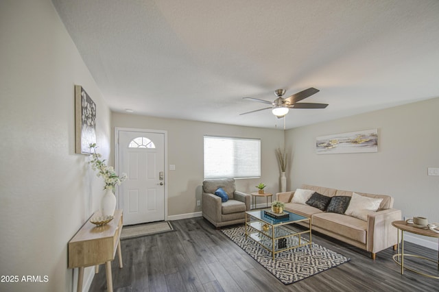 8523 W Whitton Ave, Phoenix, AZ 85037 - living room with dark wood-style flooring, ceiling fan, baseboards, and a textured ceiling